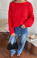 Beginning Boutique Holiday Red Tie Up Knit Cardigan red chunky knit with a deep V-back and tie detail and voluminous sleeves