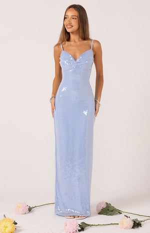 Model wears a blue sleeveless sequin maxi dress with a leg split perfect for prom.