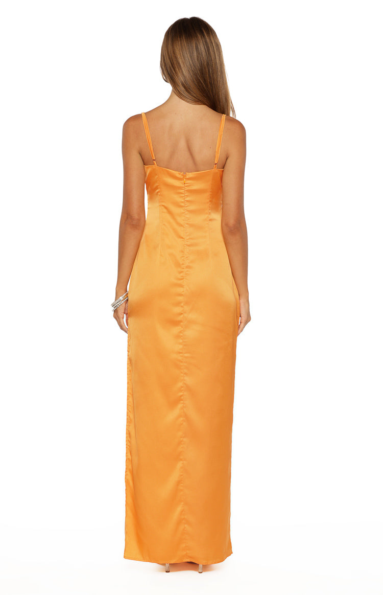 Rear view of an orange satin maxi dress with thin spaghetti straps, straight back, invisible zip, and side slit