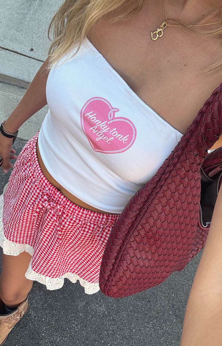 Close-up of the white tube top with a pink heart graphic and "Honky tonk Angel" text on the front