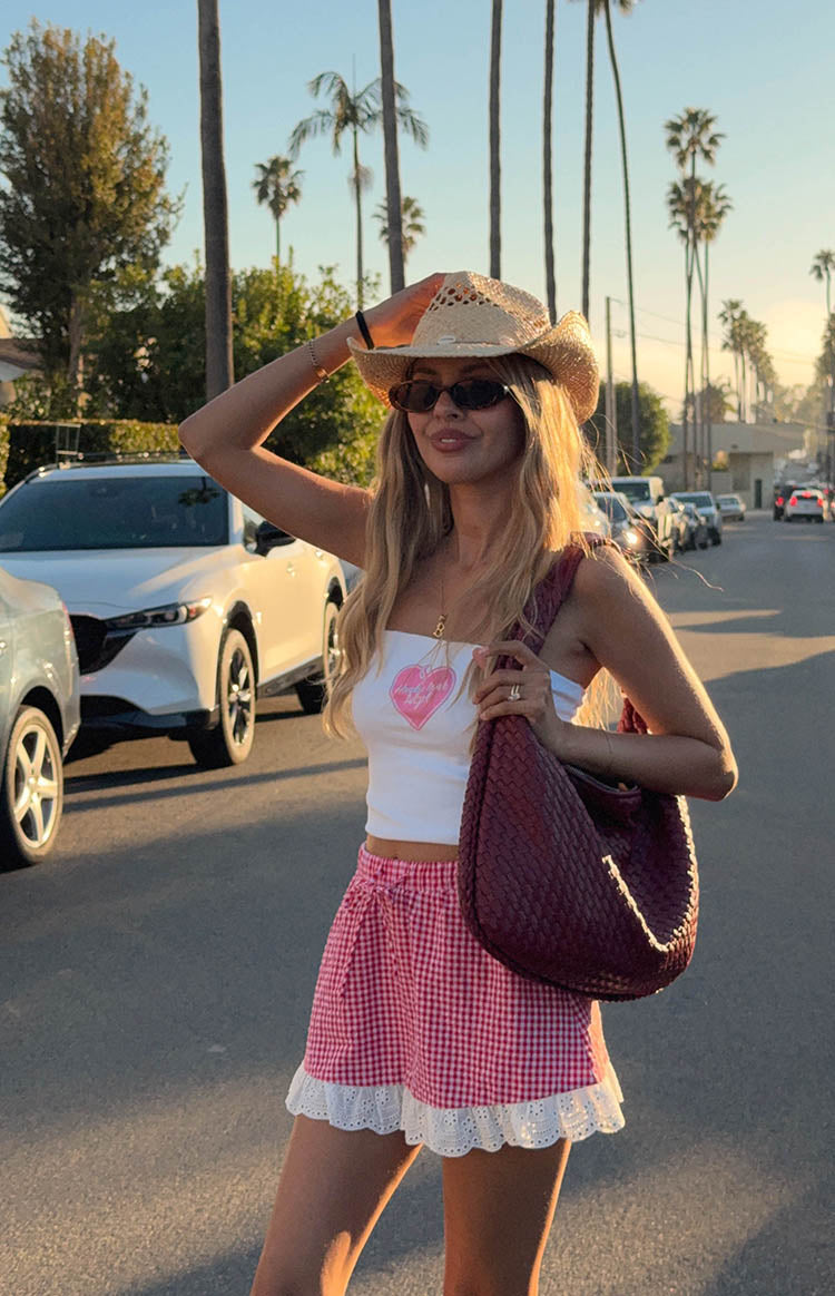 Beginning Boutique Honky Tonk White Tube Top white strapless cropped tube top with a pink heart graphic print