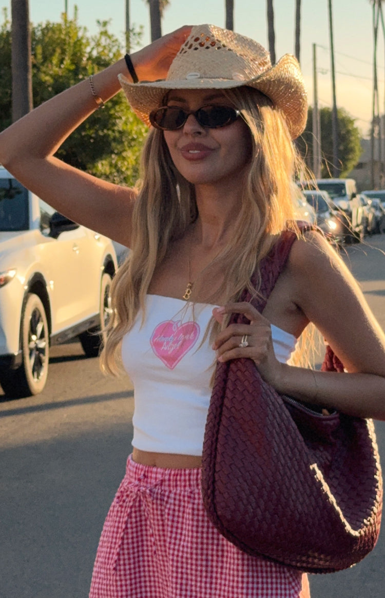 Front view of the white tube top with a large pink heart graphic and Honky Tonk Angel text