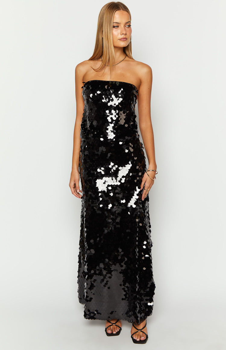 Side view of a black sequin strapless top with a side cutout and thin criss-cross straps