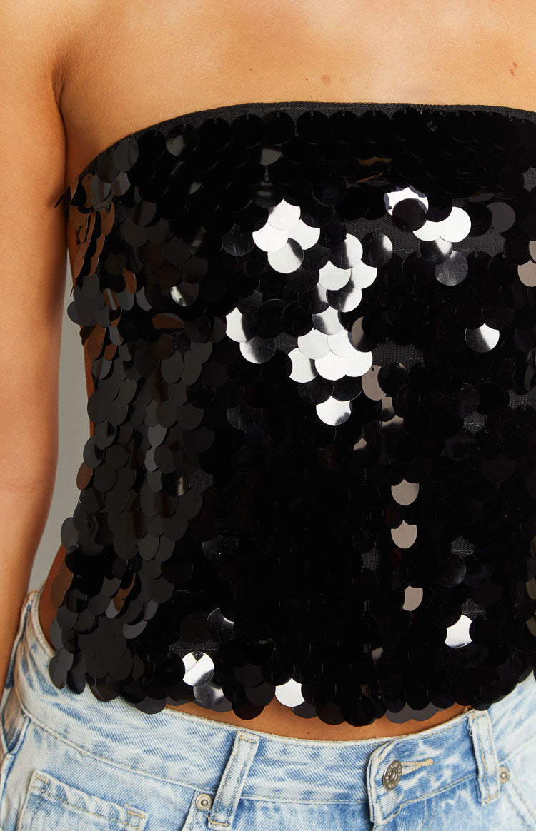 Rear view of a black sequin strapless top with a tie-back closure and thin straps