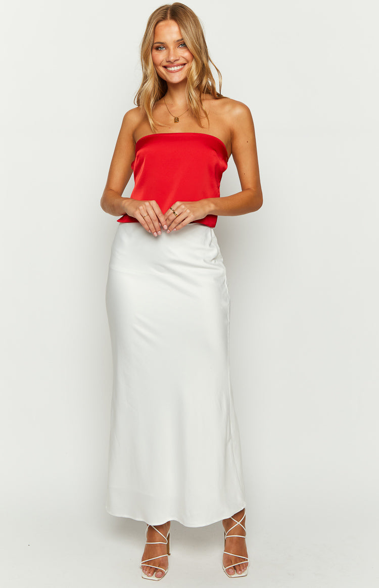 Front view of a red satin strapless top with a straight neckline and a relaxed, flowing fit