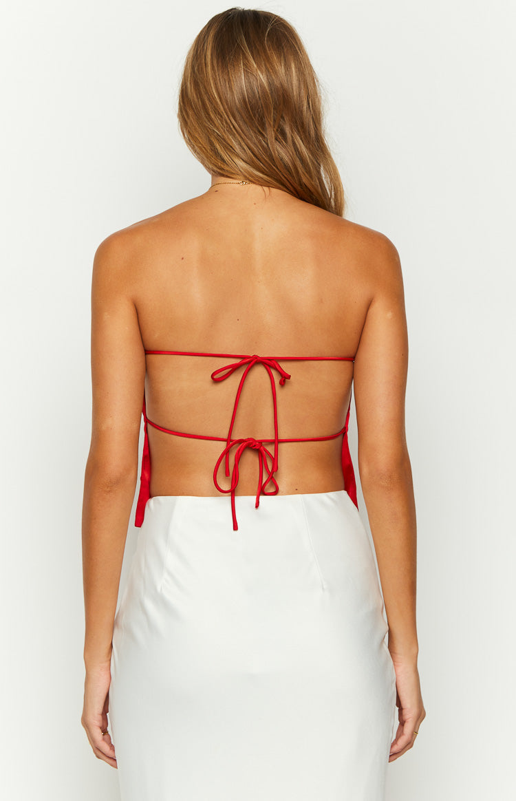 Close-up of the red satin strapless top showing the fabric texture and bust dart detail