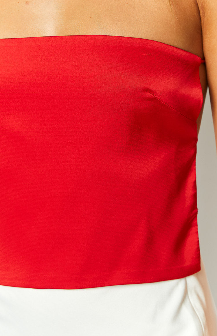 Rear view of a red satin strapless top with an open back and multiple thin tie straps
