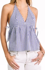 Blue and white striped halter top with a deep V-neck, gathered peplum hem, and adjustable side ties