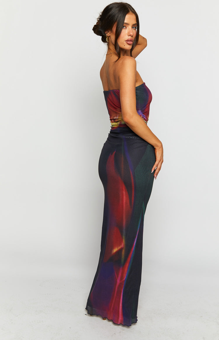 Side view of a black blurred tulip print strapless maxi dress with a lettuce hem