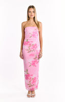 A light pink strapless maxi-dress with a ruched bodice and a flowing skirt- featuring a vibrant pink and green floral pattern. This dress is suitable for a beach wedding or a vacation.