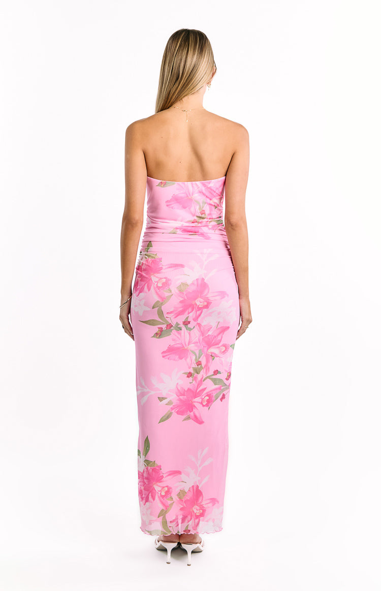 Rear view of the pink and green floral print strapless maxi dress, showing the fitted silhouette and subtle ruching