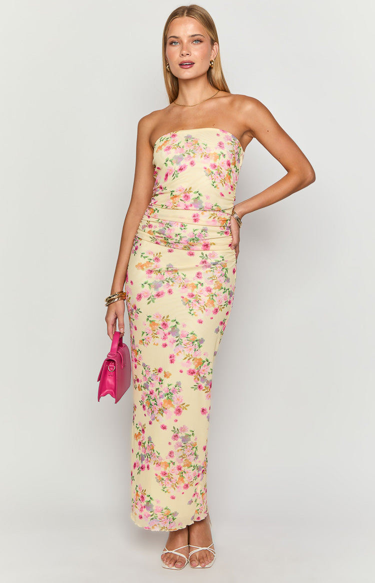 Front view of a yellow floral strapless maxi dress with ruched bodycon fit