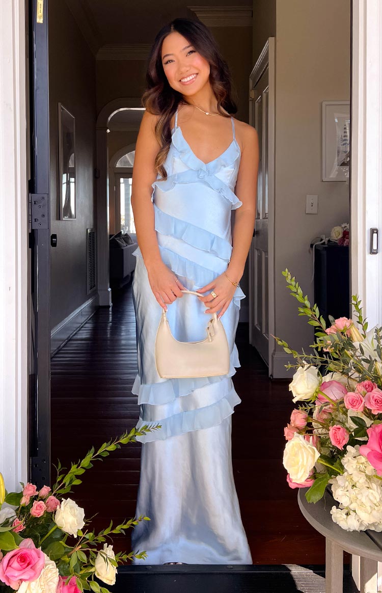 Light blue satin maxi dress with spaghetti straps, V-neckline, and cascading horizontal ruffles