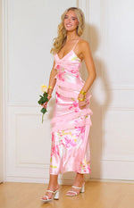Front view of a pink satin maxi dress with a vibrant floral print and cascading tiered ruffles