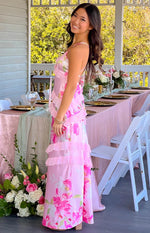 Pink floral print maxi dress with a ruffled V-neckline and tiered ruffles down the body