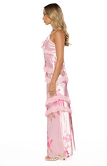 Rear view of a pink floral maxi dress with criss-cross tie-back straps and tiered ruffles