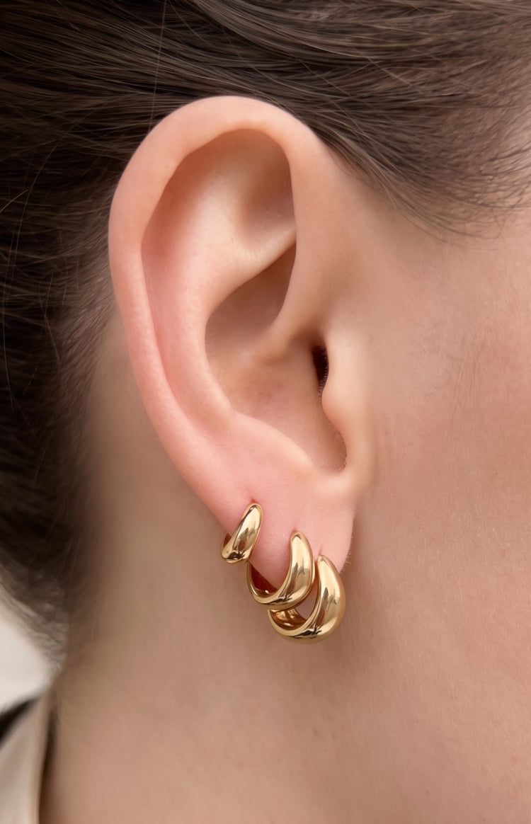 Beginning Boutique Isolde Gold Three Piece Huggie Earring Set three gold thick rounded huggie earrings in varying sizes