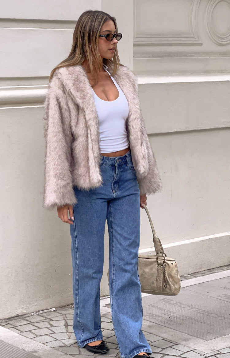 Sand faux fur jacket with a wide collar, long sleeves, and a cropped, slightly oversized fit