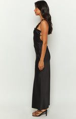 Side view of a black satin maxi dress with ruffled straps and side cutouts