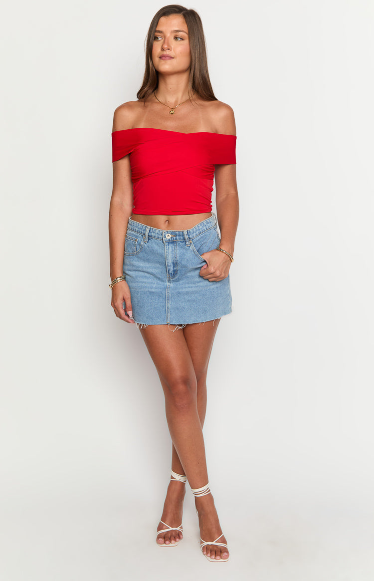 Red off-shoulder crop top with a crossover bust detail and fitted silhouette