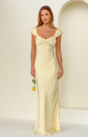 Beginning Boutique Jacky Yellow Satin Maxi Dress light yellow satin maxi dress with a sweetheart neckline, ruched bust, and short cap sleeves