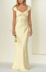 Front view of a yellow satin maxi dress featuring a ruched sweetheart neckline and draped off-shoulder cap sleeves