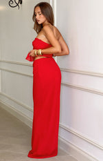 Side view of a bright red chiffon maxi skirt with a fitted waist and flowy drape