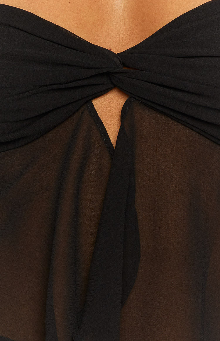 Black strapless top with a twisted knot detail at the bust and a sheer, flowy lower panel