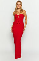 Front view of a red maxi skirt, fitted through the hips and flaring gently to the floor