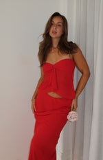 Full length view of a red fitted maxi skirt in a smooth stretch fabric