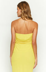 Back view of the yellow strapless top showing the elasticated top edge and sheer mid-back panel