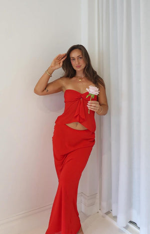 Beginning Boutique Jacqulin Red Maxi Skirt red draped waist maxi skirt with a flared hem