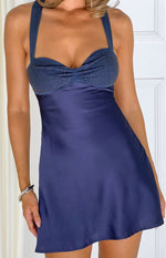 Navy mini dress with a close-up on the rhinestone embellished bust and ruched detail