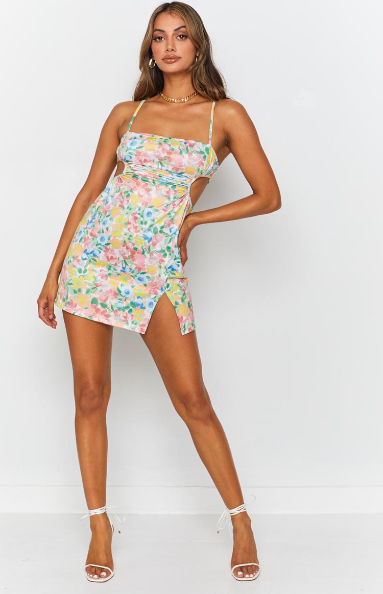 Pastel floral mini dress with side cut-outs, ruched detailing, and a high thigh split