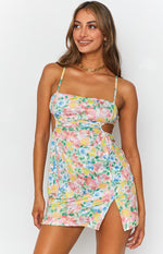 Multi-colour floral print mini dress with asymmetrical neckline, side cutouts, and thigh split