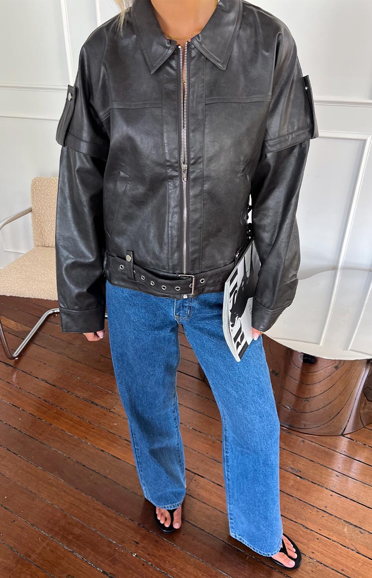 Relaxed fit washed black PU jacket with silver zip, collar, chest flap pockets, shoulder epaulets, and belted waist