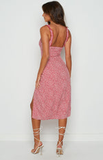 Red midi dress with white floral print, square back, ruffled shoulder straps, and side split