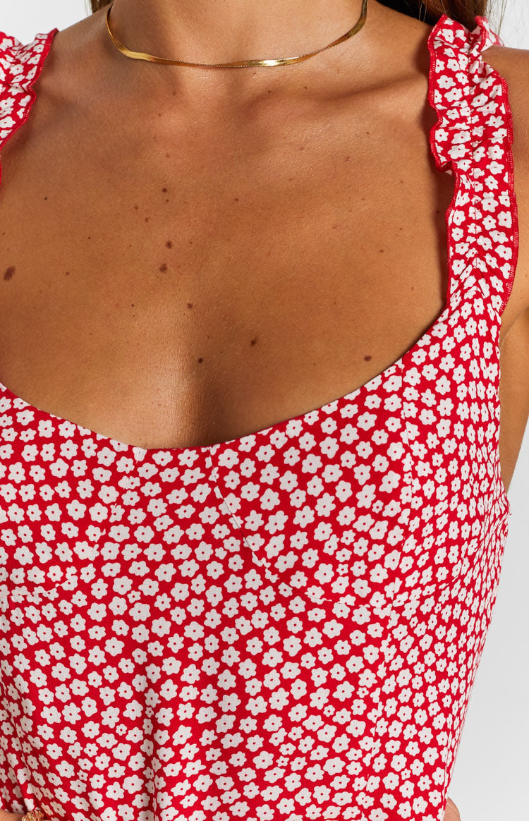 White daisy print on red dress with scoop neckline and ruffled shoulder straps