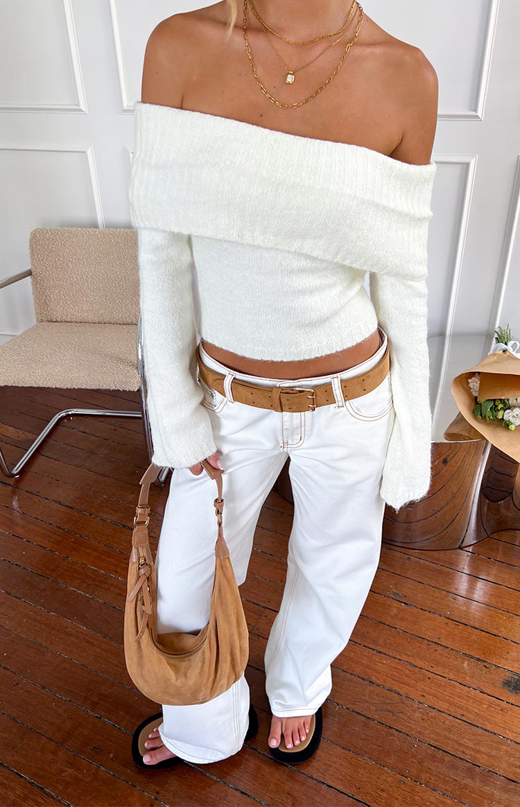 Front view of a cream off-shoulder cropped sweater with a fuzzy knit texture