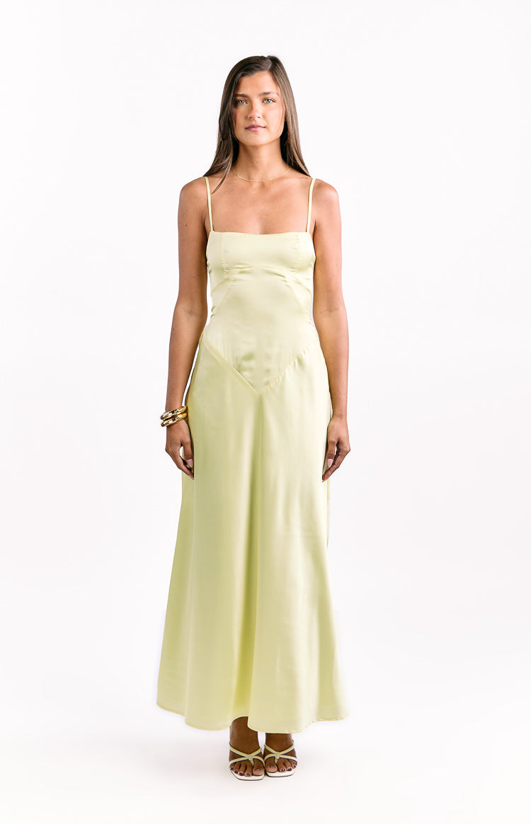 Front view of a light yellow satin maxi dress with a straight neckline and V-shaped seam detail on the bodice