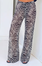 Beginning Boutique Joplin Black Sheer Zebra Print Pants black and white zebra print sheer wide-leg pants with a drawstring wa