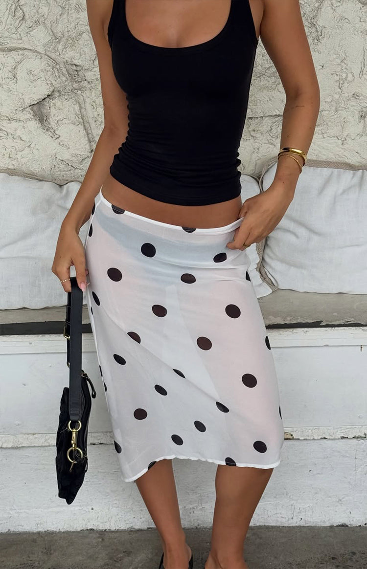 Beginning Boutique Jordan White Polka Dot Sheer Midi Skirt white sheer midi skirt with black polka dots and elastic waist