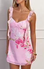 Close-up of the pink floral chiffon mini dress showing the sweetheart neckline with bow and ruffled straps