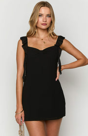 Black chiffon mini dress with a sweetheart neckline, ruched bust, and ruffled shoulder straps that tie