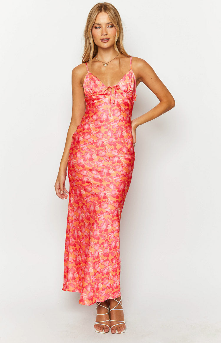 Front view of an orange and pink floral print maxi dress featuring a sweetheart neckline and tie-front bust