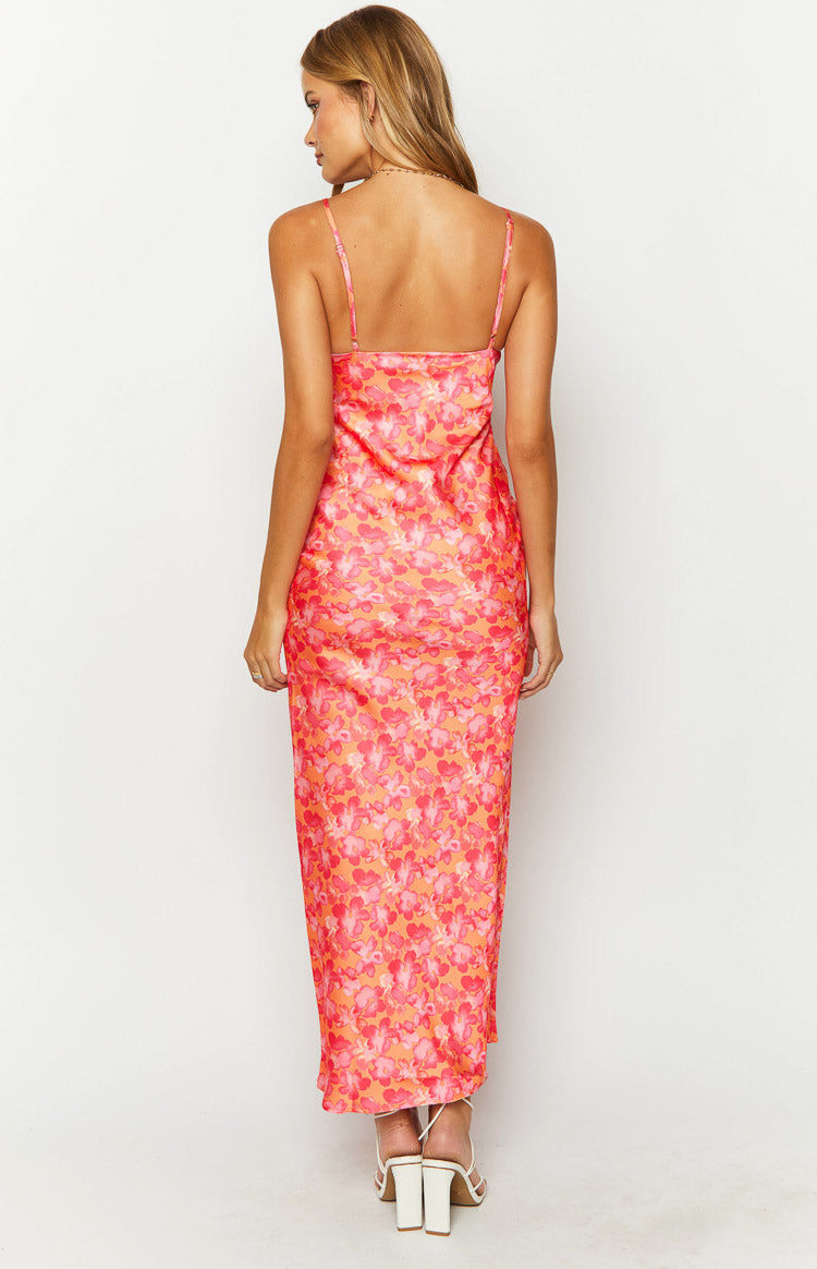 Close-up of the orange and pink floral print dress showing the tie-front V-neck and ruched bust