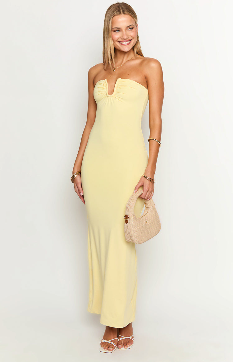 Front view of a yellow strapless maxi dress with a ruched V-cutout bust and a fitted silhouette