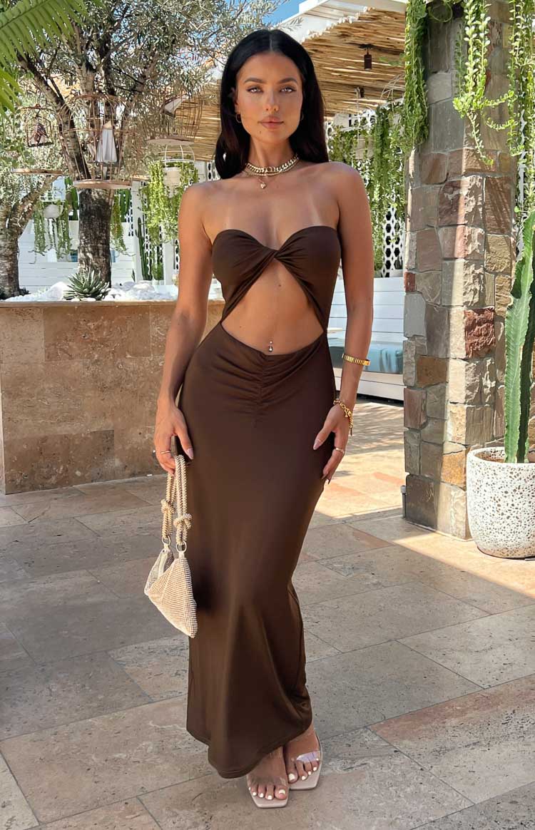 Brown strapless midi dress with twisted bandeau top, midriff cutout, and ruched bodycon skirt