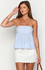 Front view of a light blue and white striped strapless top with a gathered peplum hem