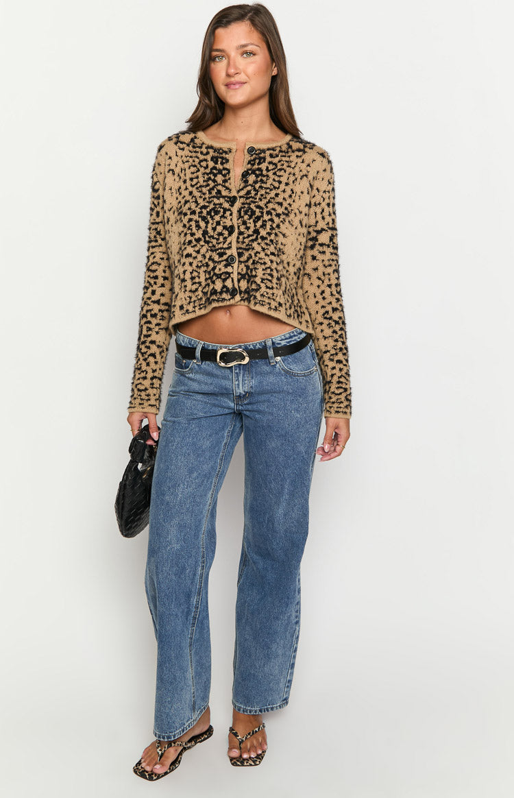 Front view of a tan and black leopard print cropped cardigan with long sleeves and button-front